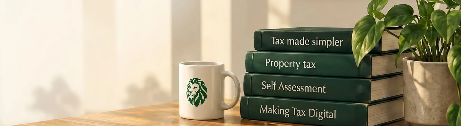 TaxSimba mug, stack of green tax guides and a potted plant on a wooden desk